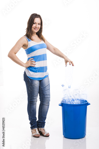 Photo: Beautiful young woman recycling Beautiful young woman recycling