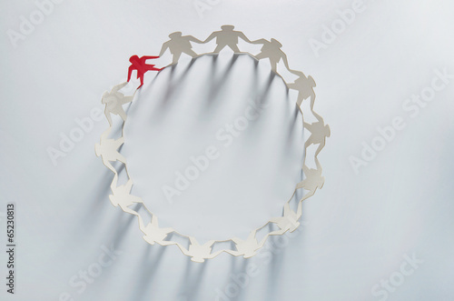 Photo: Leader businesswoman standing out in paper chain Leader businesswoman standing out in paper chain