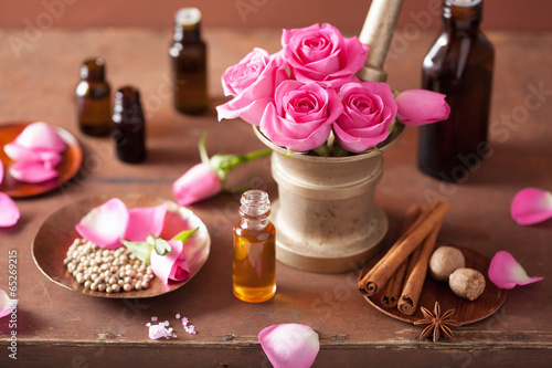 Photo: spa and aromatherapy set with rose flowers mortar and spices spa and aromatherapy set with rose flowers mortar and spices