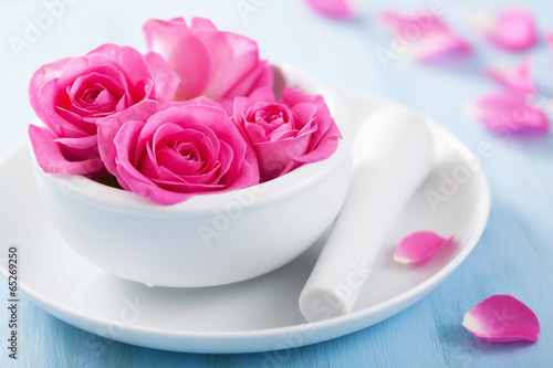 Photo: pink rose flowers in mortar for aromatherapy and spa pink rose flowers in mortar for aromatherapy and spa