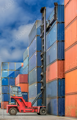 Photo: Crane lifter handling container Crane lifter handling container