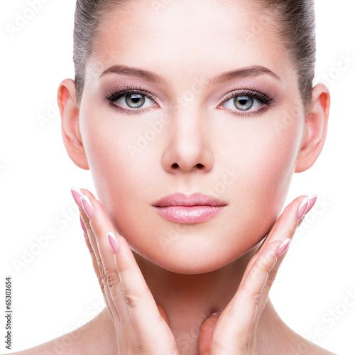 Photo: Beautiful healthy face of the young pretty woman. Beautiful healthy face of the young pretty woman.