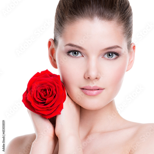 Photo: Beautiful young woman with red rose. Beautiful young woman with red rose.