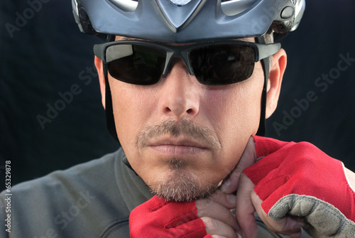 Photo: Bicycle Courier Puts On Helmet Bicycle Courier Puts On Helmet