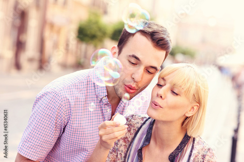 Photo: Young couple and bubbles Young couple and bubbles