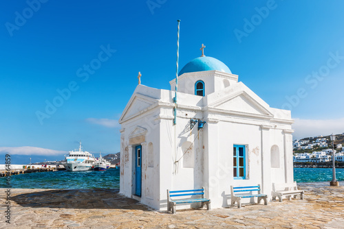  Whitewashed and blue domed Agios Nikolaos church in Mykonos