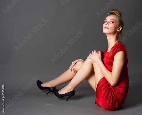 Photo: Sexy slim woman in red dress Sexy slim woman in red dress