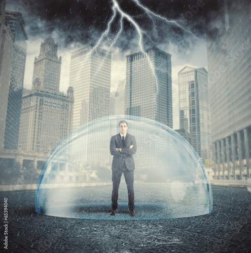Photo: Businessman protected from the crisis Businessman protected from the crisis