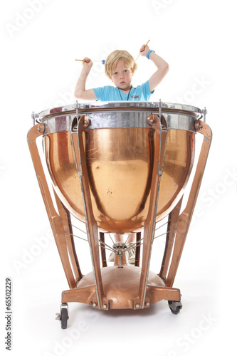 Photo: young boy playing kettledrum young boy playing kettledrum