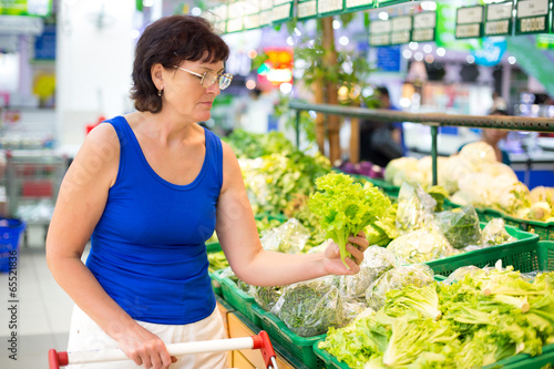 Photo: woman buys salad woman buys salad