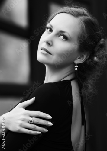 Photo: Happy fashion woman in black dress Happy fashion woman in black dress
