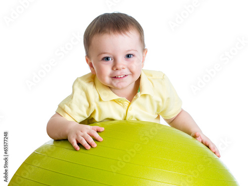 Photo: Kid girl with gymnastic ball isolated Kid girl with gymnastic ball isolated
