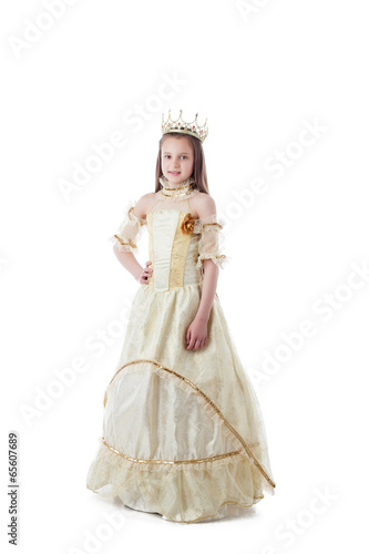 Photo: Smiling little model posing in magnificent dress Smiling little model posing in magnificent dress