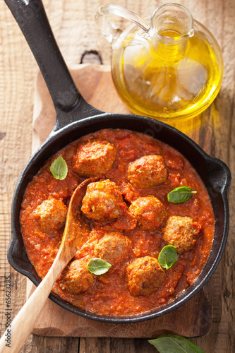 Photo: meatballs with tomato sauce in black pan meatballs with tomato sauce in black pan