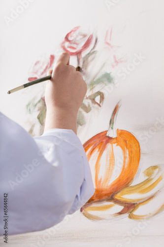 Photo: Woman's hand painted a still life Woman's hand painted a still life