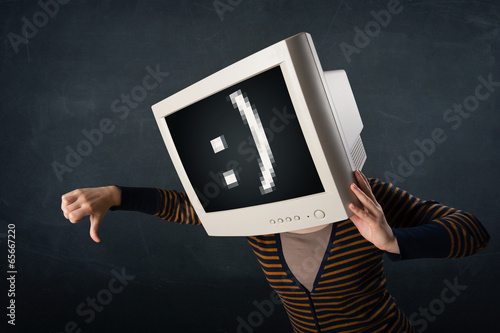 Photo: Funny girl with a monitor box on her head and a smiley face Funny girl with a monitor box on her head and a smiley face