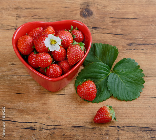 Photo: Strawberries in red heart shape bowl Strawberries in red heart shape bowl