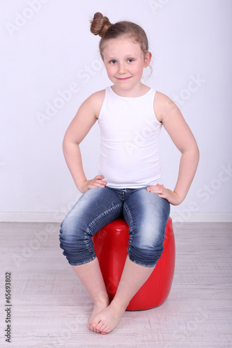 Photo: Beautiful small girl sitting Beautiful small girl sitting