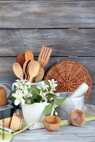 Photo: Composition of wooden cutlery, mortar, bowl and cutting board Composition of wooden cutlery, mortar, bowl and cutting board