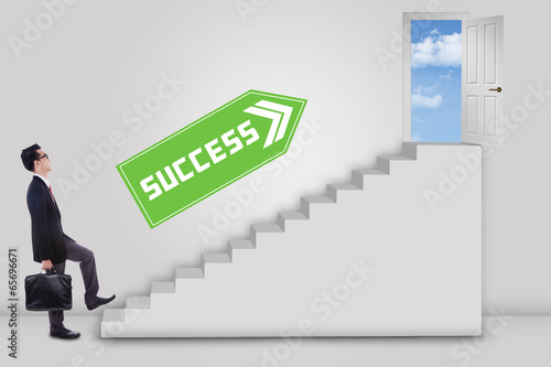 Photo: Businessman stepping up to success Businessman stepping up to success