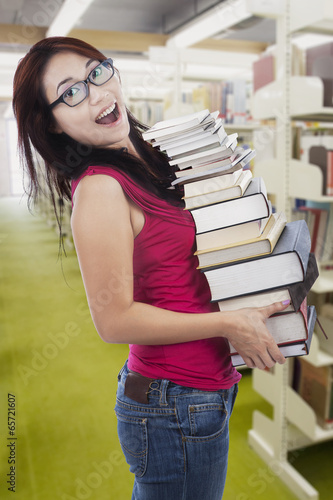 Photo: Student borrow many books in library Student borrow many books in library