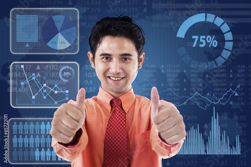 Photo: Successful businessman with futuristic interface Successful businessman with futuristic interface