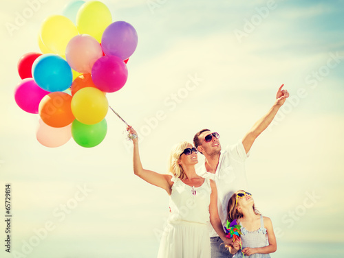 Photo: family with colorful balloons family with colorful balloons