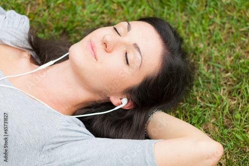 Photo: Relaxed woman listening music Relaxed woman listening music