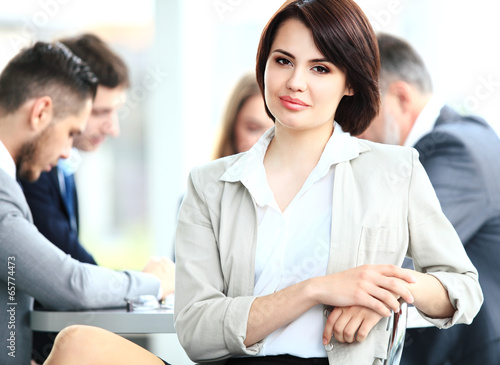 Photo: business woman with her staff business woman with her staff