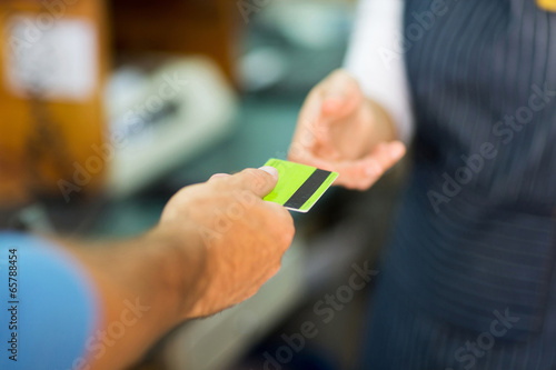 Photo: customer paying with credit card customer paying with credit card