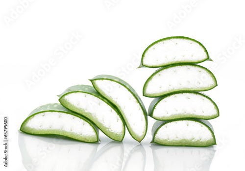 Photo: aloe vera fresh leaf. isolated over white aloe vera fresh leaf. isolated over white