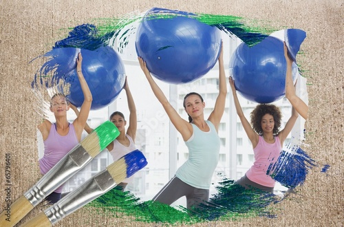 Photo: Composite image of fitness class at the gym Composite image of fitness class at the gym