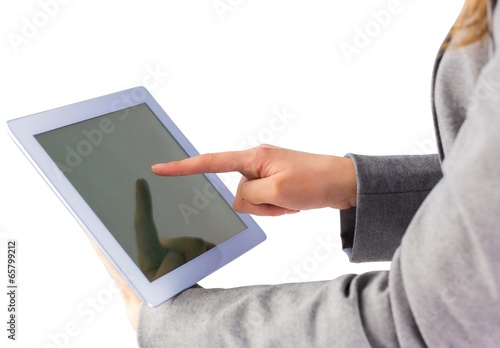 Photo: Businesswoman using a tablet pc Businesswoman using a tablet pc
