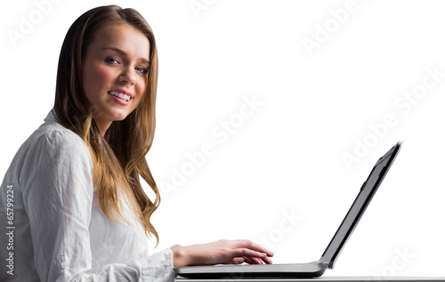 Photo: Businesswoman typing on her laptop Businesswoman typing on her laptop