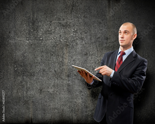 Photo: Man with tablet pc Man with tablet pc