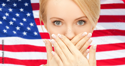 Photo: woman with hands over mouth woman with hands over mouth