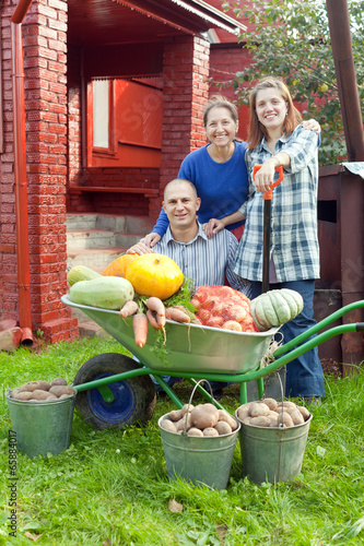 Photo: Man and women with harvest Man and women with harvest