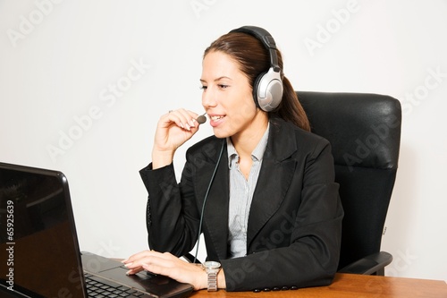 Photo: Business dressed female model in calling centar Business dressed female model in calling centar