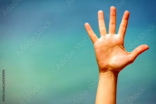 Photo: Close up of a open hand, on blue background. Close up of a open hand, on blue background.