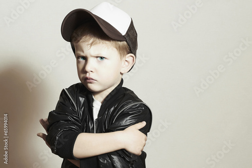 Photo: Little boy.Hip-Hop Style.fashion children.Young Serious Child Little boy.Hip-Hop Style.fashion children.Young Serious Child