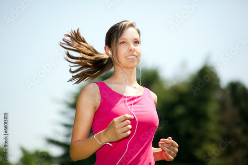 Photo: Running woman in park in summer training Running woman in park in summer training