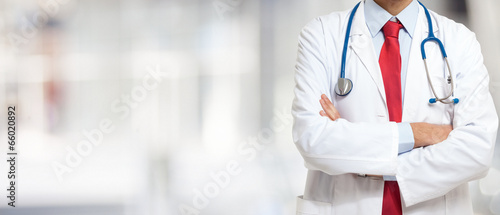 Photo: Doctor in front of a bright background Doctor in front of a bright background