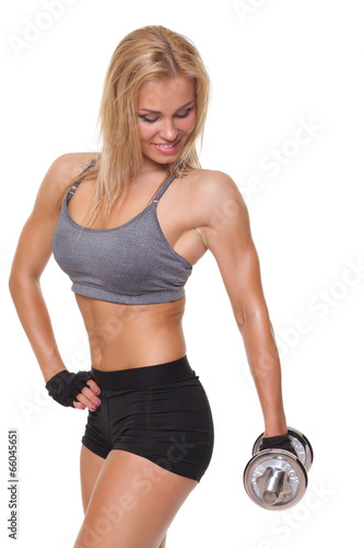 Photo: athletic young woman doing a fitness workout with dumbbells athletic young woman doing a fitness workout with dumbbells
