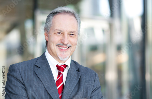 Photo: Mature businessman smiling Mature businessman smiling