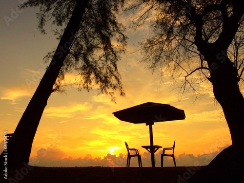 Instant Collection: restaurant table on beach at sunrise restaurant table on beach at sunrise