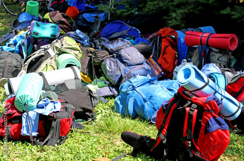 Photo: colorful pile of backpack of Scouts during an excursion in the n colorful pile of backpack of Scouts during an excursion in the n
