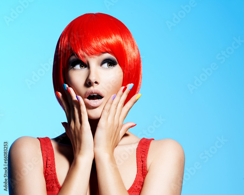 Photo: Surprised face of an young pretty woman with red hairs Surprised face of an young pretty woman with red hairs