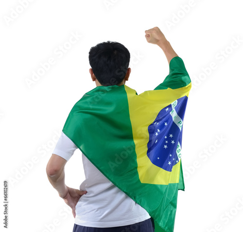 Photo: Brazilian man celebrates with flag and mask Brazilian man celebrates with flag and mask