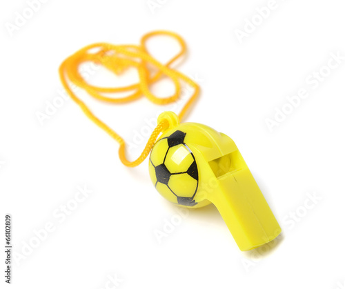 Photo: football shape whistle isolated on a white background. football shape whistle isolated on a white background.