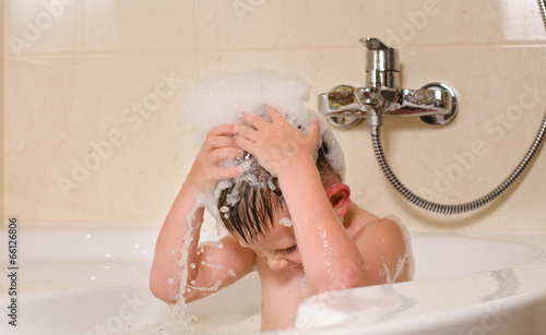 Photo: Boy with bubbles on his head Boy with bubbles on his head